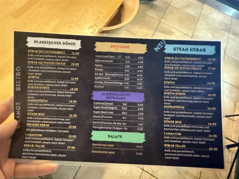 Speisekarte des Orange Bistro: Döner, Steak Kebab, Getränke und Salate
